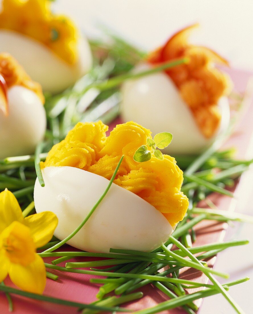 Eggs stuffed with salmon cream and garnished with chives