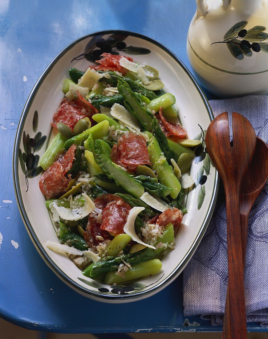 Warm asparagus salad with salami and Parmesan