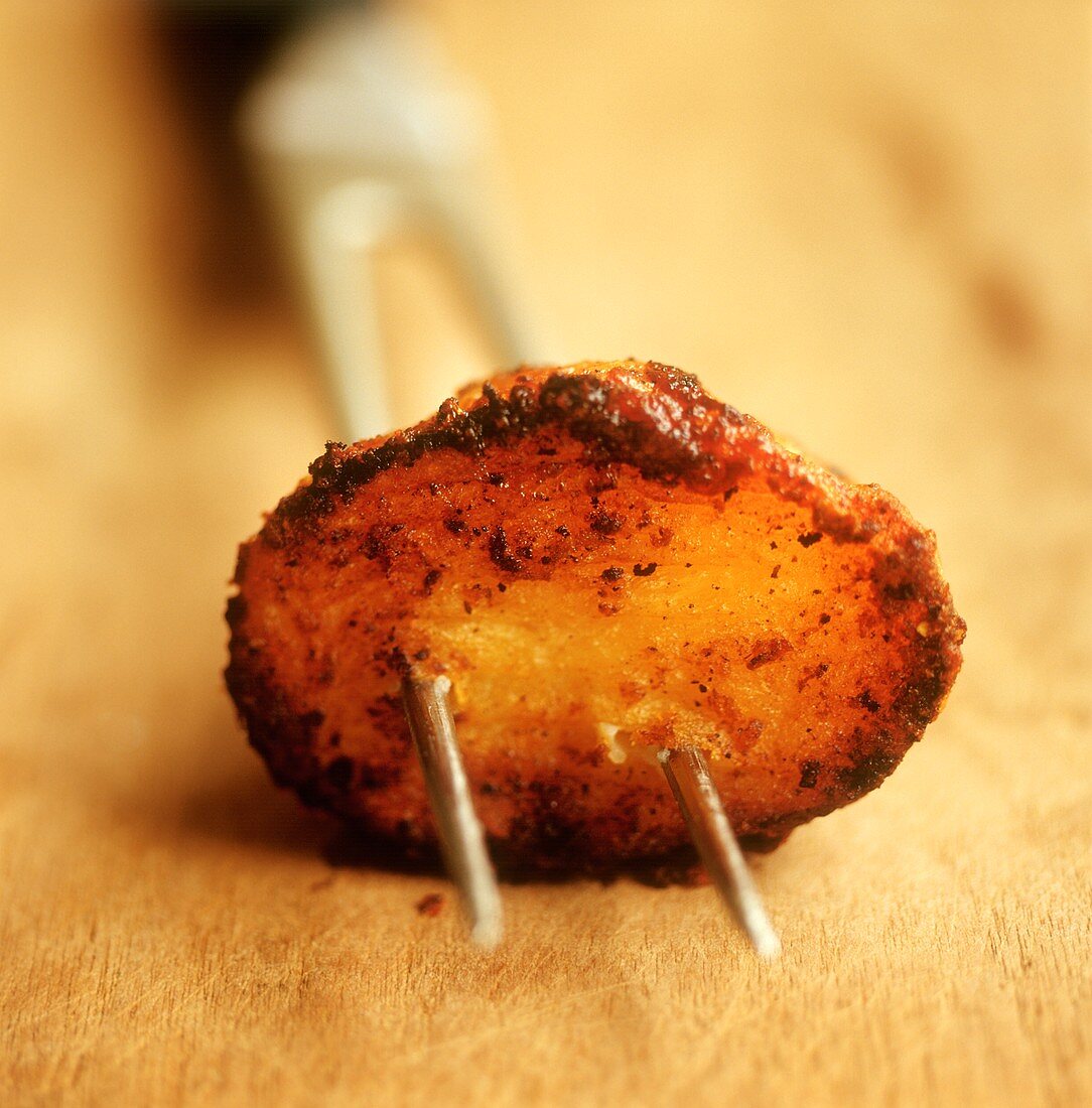 Roast potato on fork