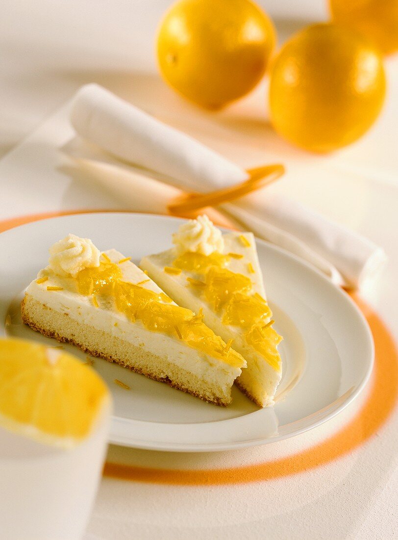 Two pieces of orange cream sponge gateau