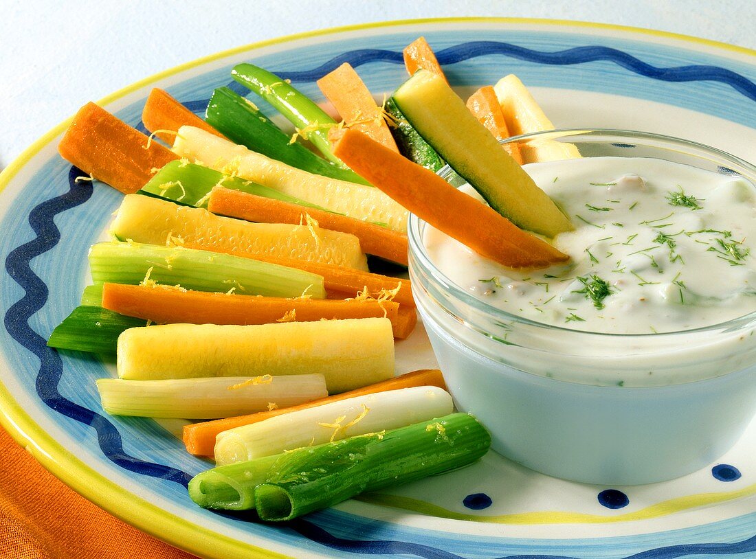 Braised vegetable sticks with yoghurt and walnut dip