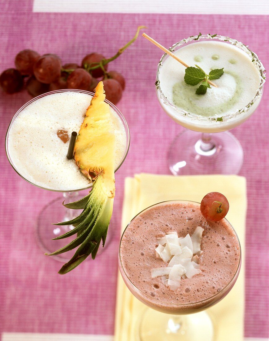 Three alcoholic milkshakes (coconut, grape and pineapple)