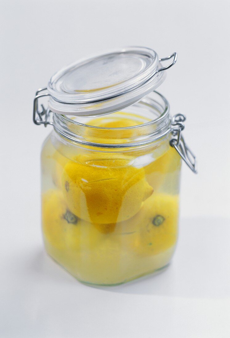 Brine-pickled lemons in preserving jar