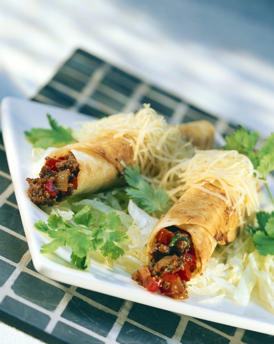 Tortillas with mince, grated cheese and lettuce