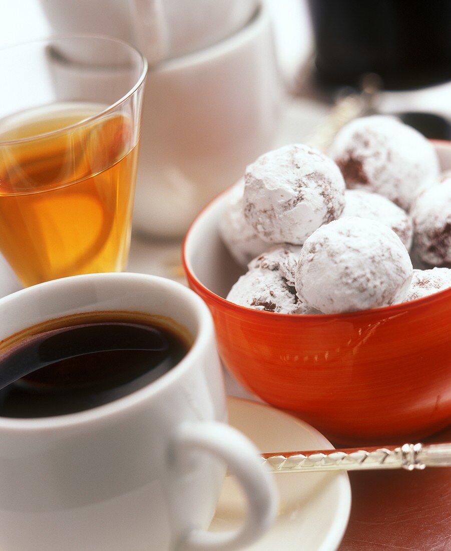 Chocolate truffles in a bowl, cup of coffee and sweet wine