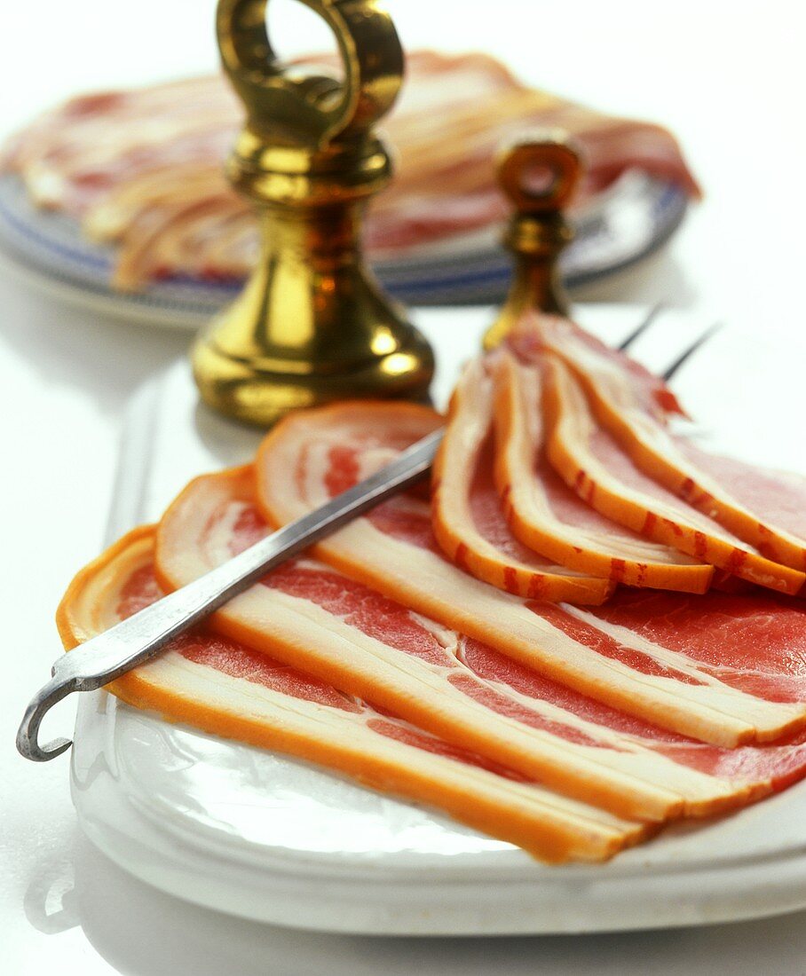 Slices of ham on a china plate