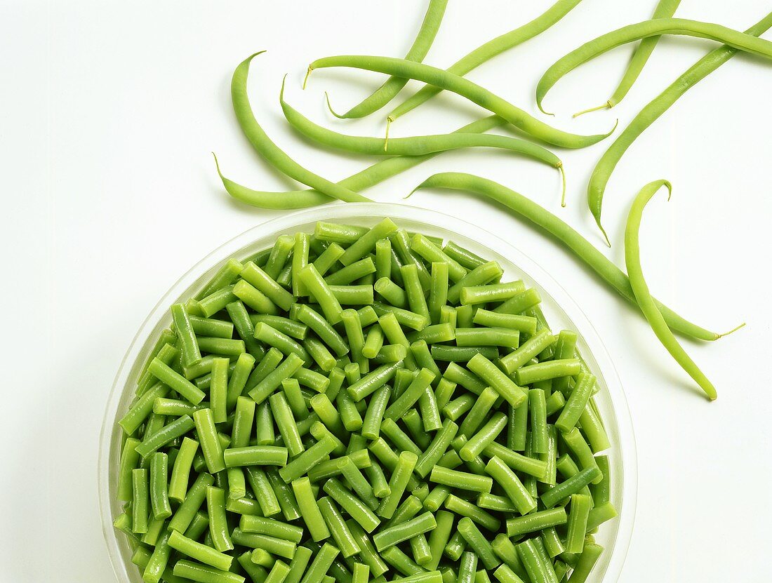 French beans, glass dish of sliced beans beside them