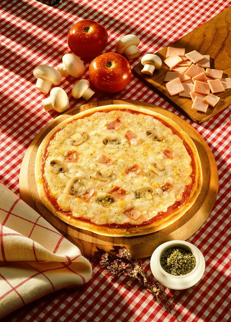 Ham and mushroom pizza with a lot of cheese; ingredients