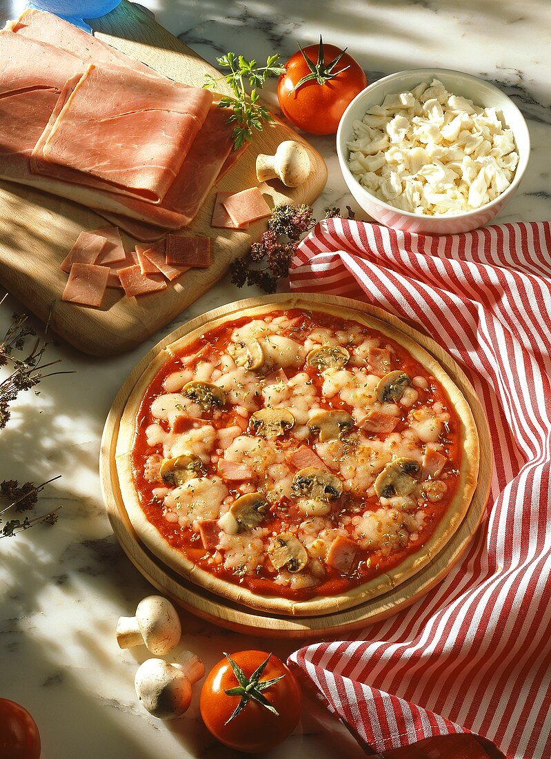 Ham and mushroom pizza with ingredients