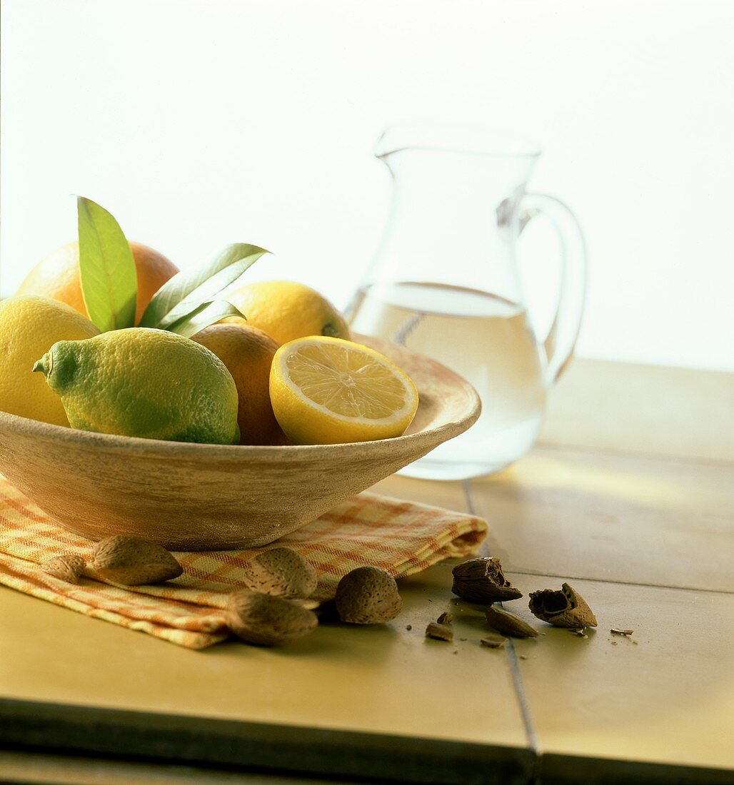 Mediterranean still life with lemons in a bowl, almonds