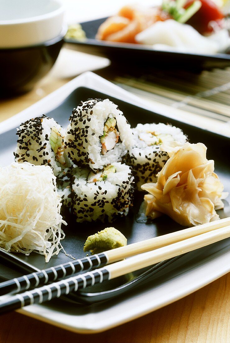 California maki (surimi and avocado, coated in sesame)