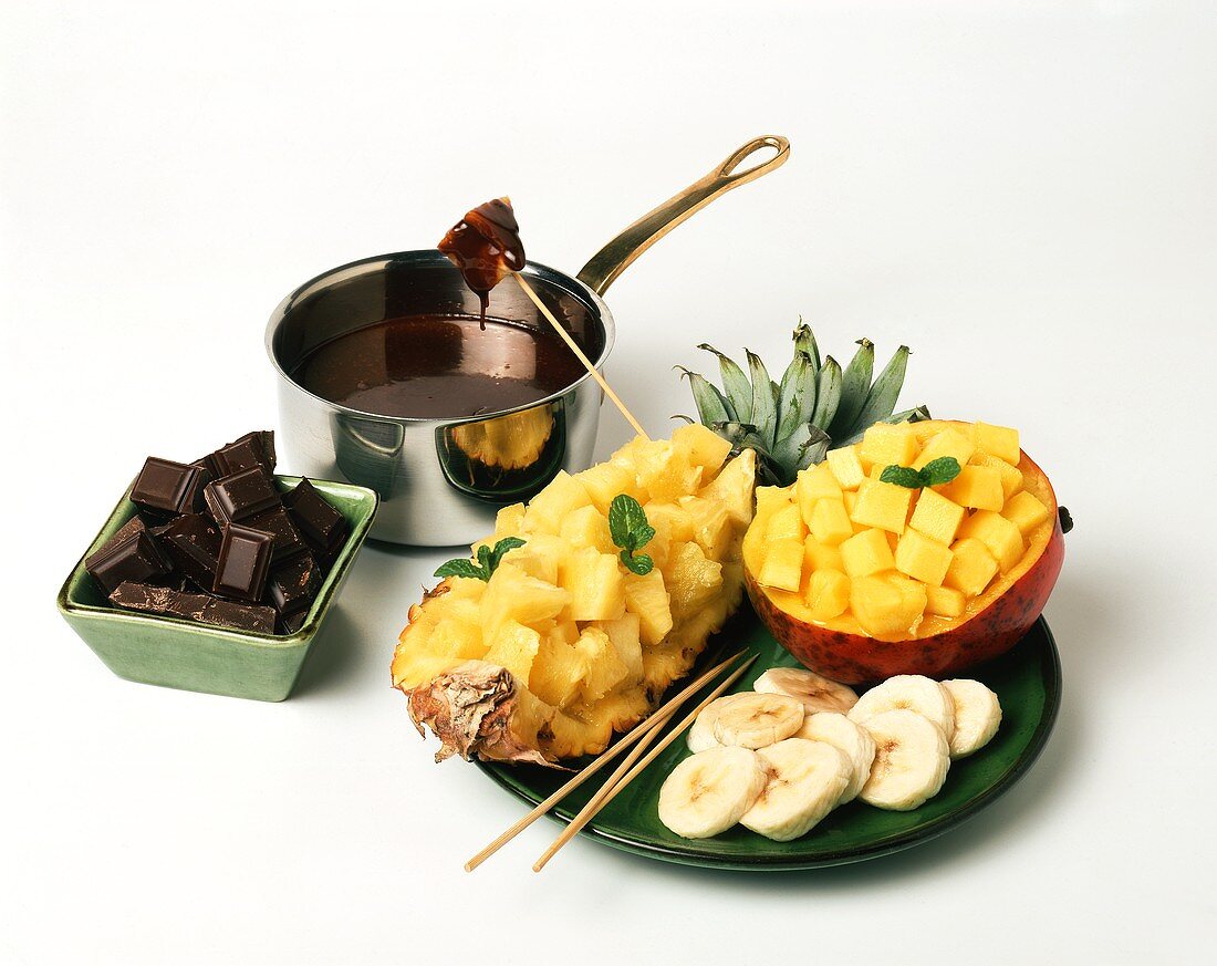 Chocolate fondue with mango, pineapple and bananas