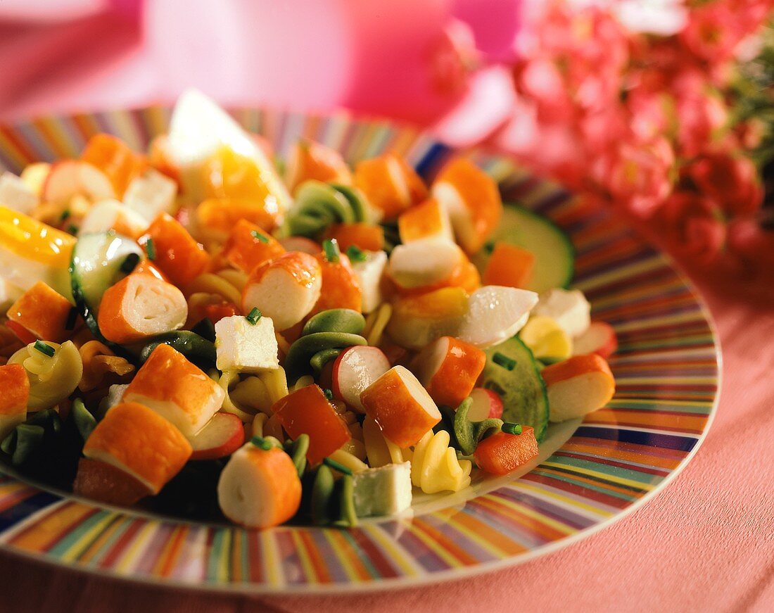 Pasta salad with surimi, sheep's cheese and vegetables