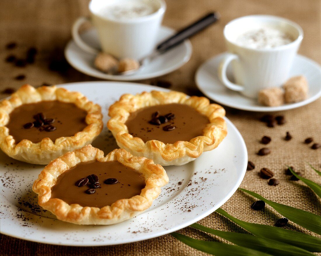 Small coffee cream tartlets in puff pastry