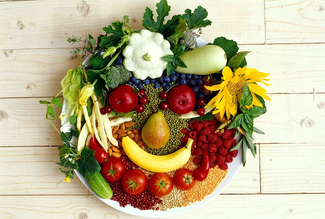 Food collage: face made from vegetables, fruit and spices