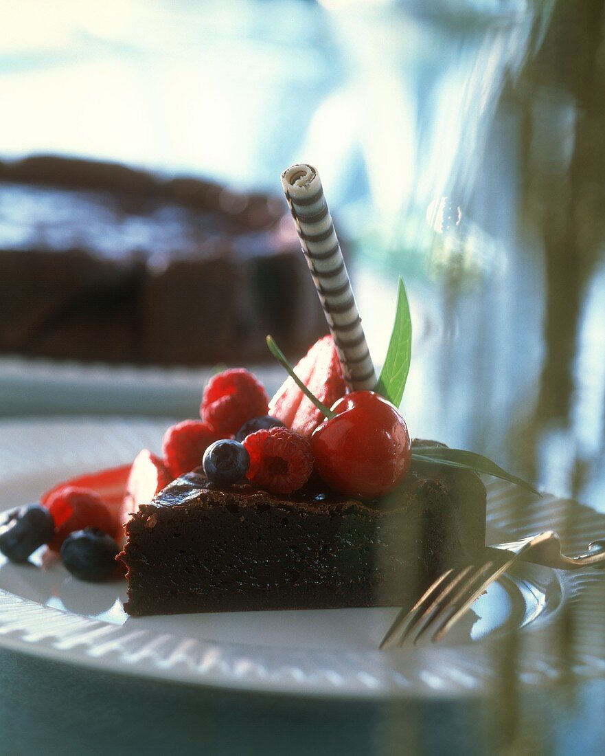A piece of chocolate cake with berries