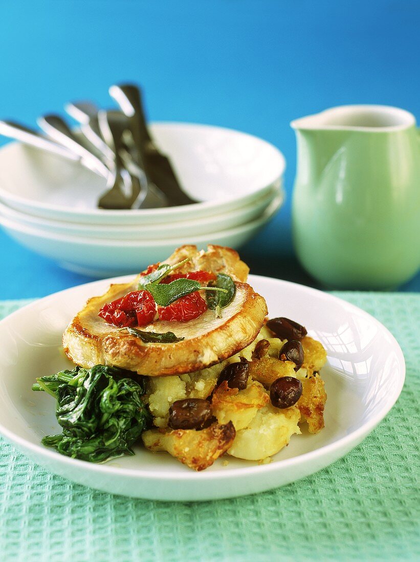 Pork chop on mashed potato and spinach