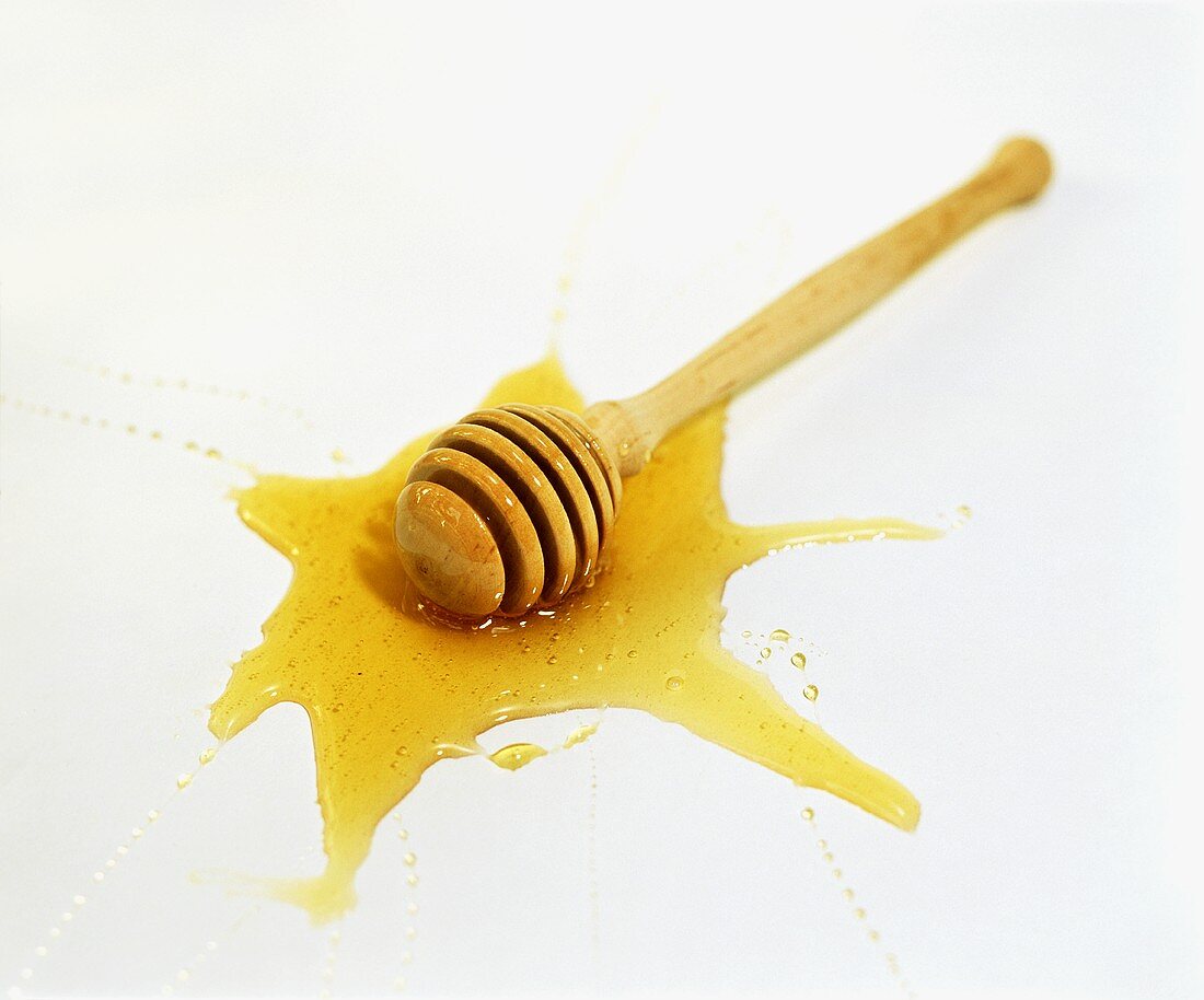 Honey dipper in a pool of honey