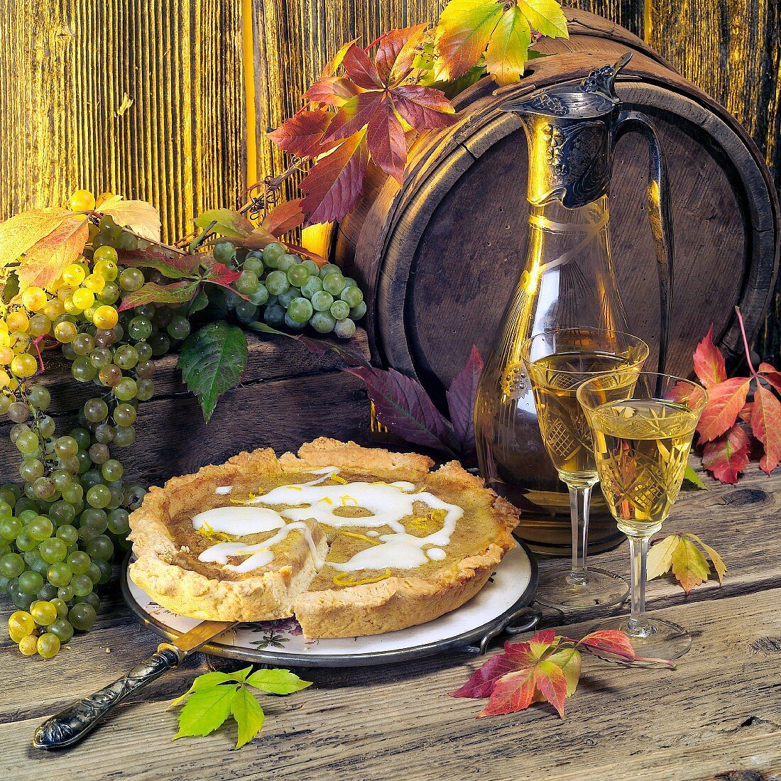 Autumnal still life with grape tart and wine