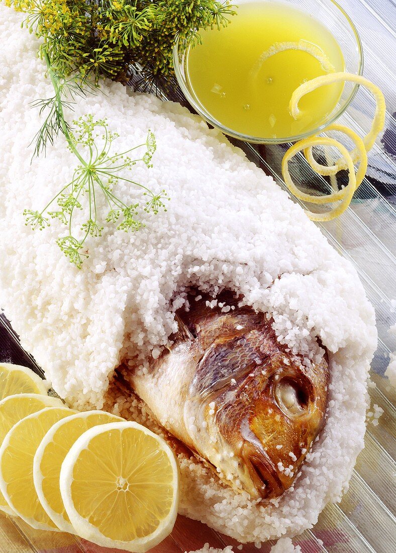 Fish (Gilthead bream) baked in salt crust