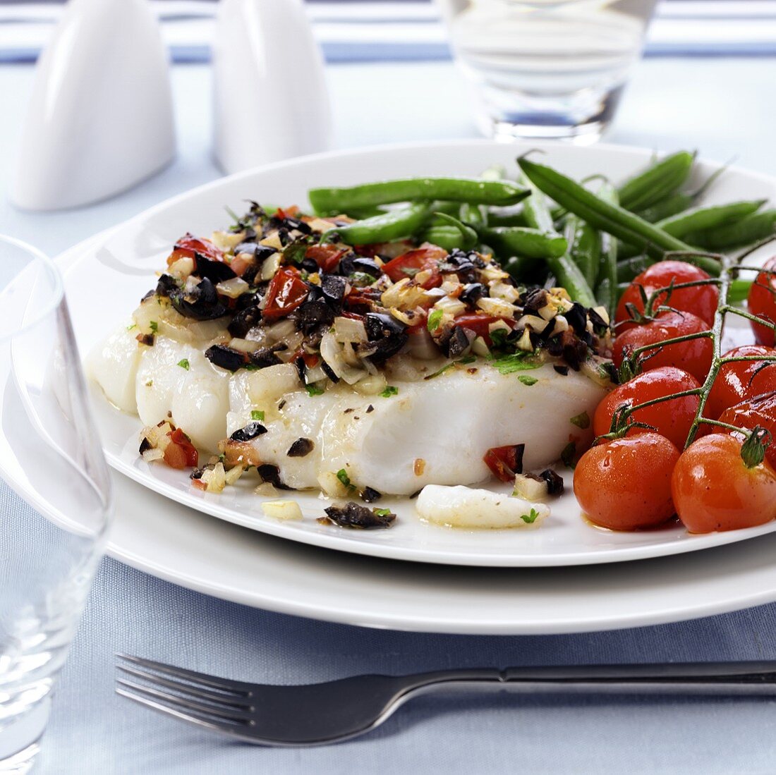 Cod fillet with tomato and olive crust