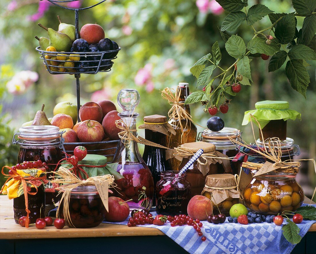 Still life with different preserved fruits in jars