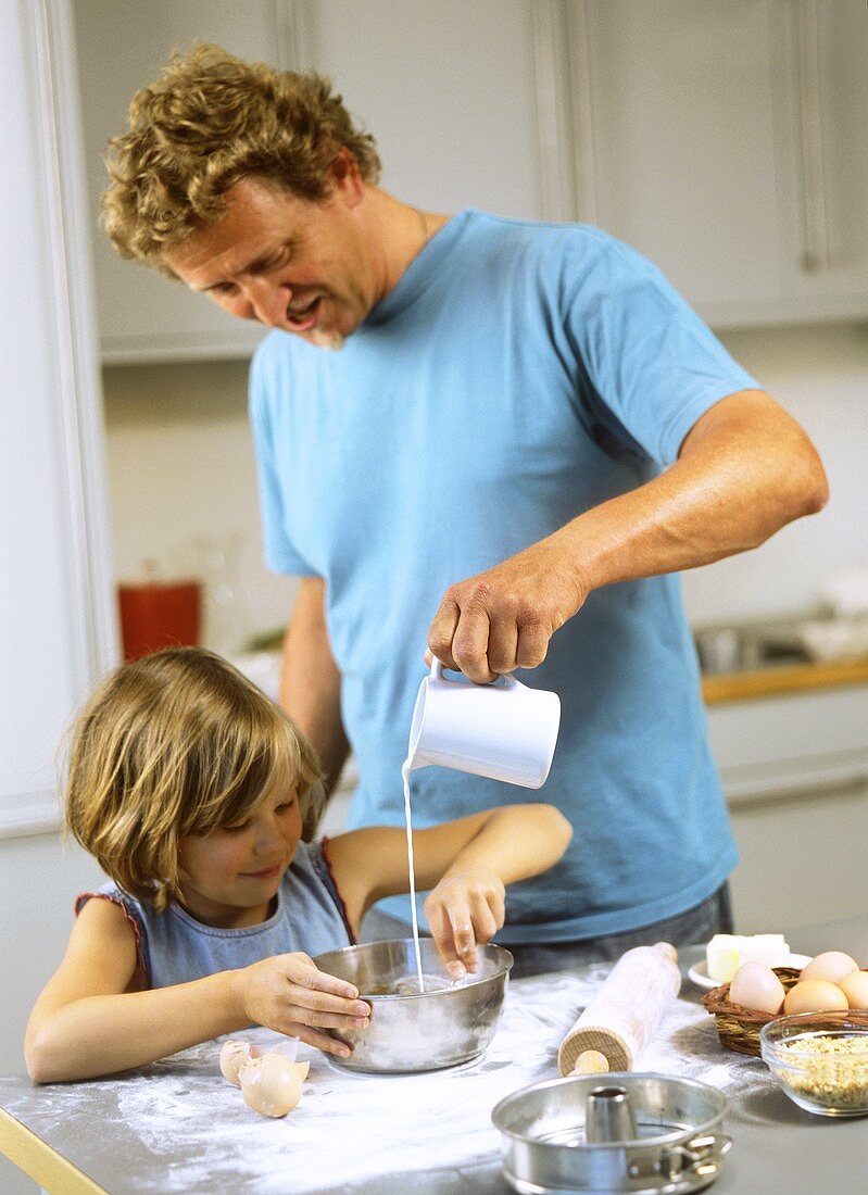 Father and daughter baking