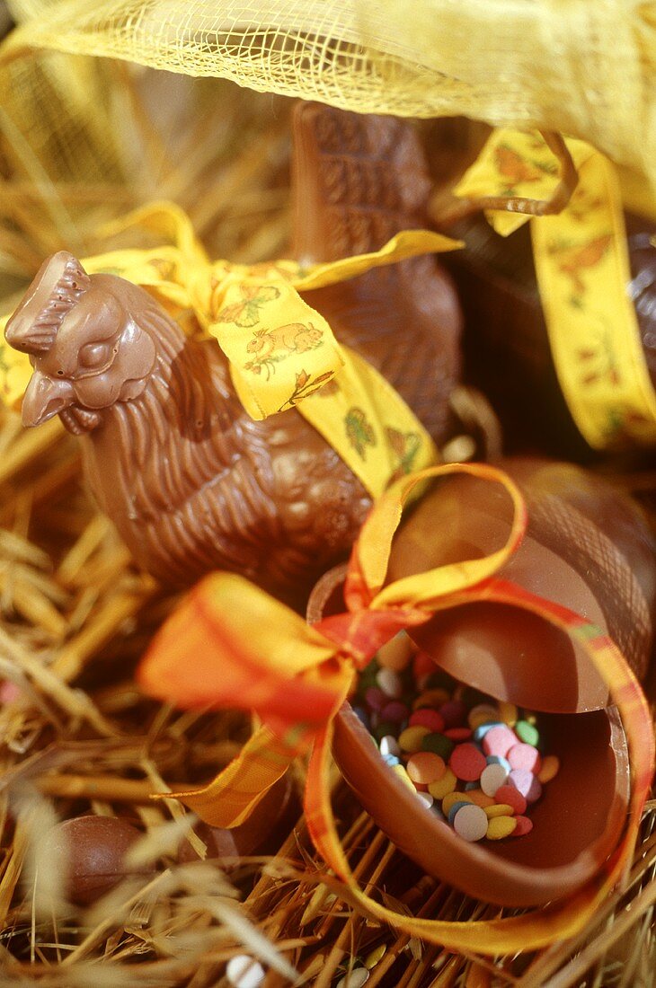 Easter sweets: chocolate chicken & chocolate egg on straw