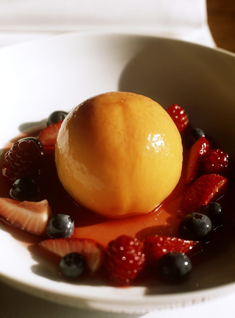 Poached pear with berries