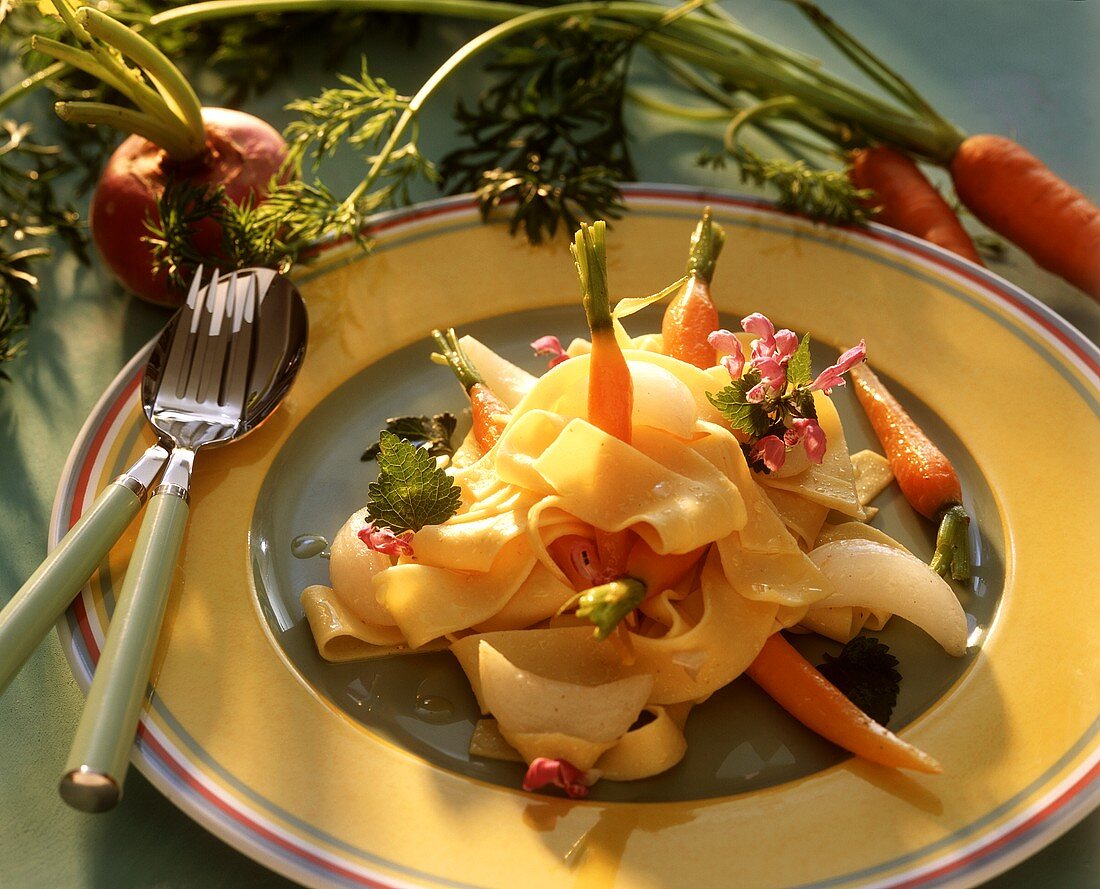 Ribbon pasta with white turnips and young carrots