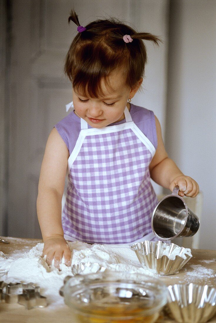 Small girl baking