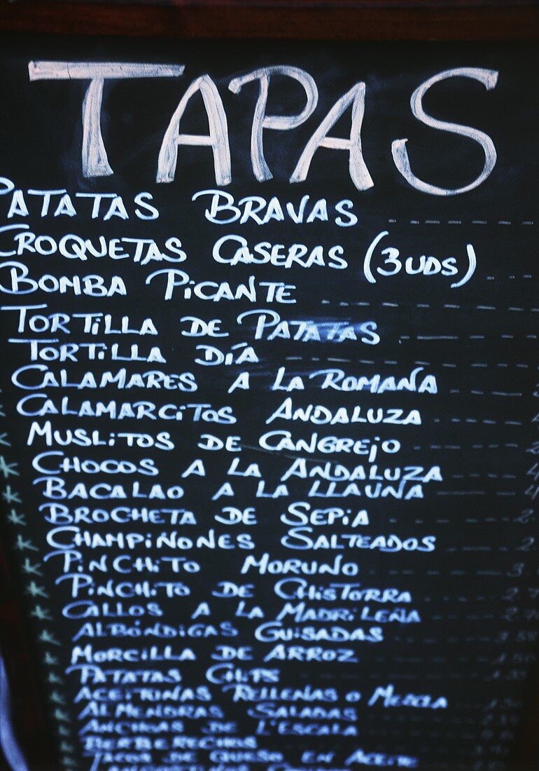Tapas menu on blackboard in a bar