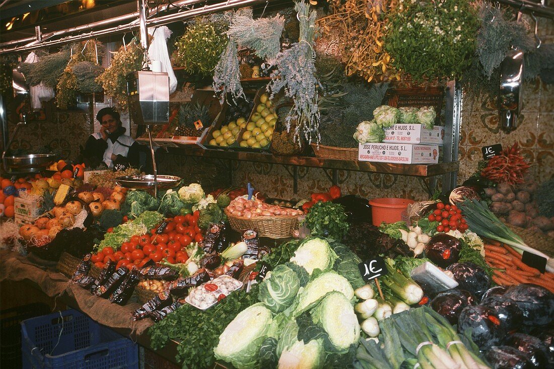 Fresh vegetables and herbs on a market stall
