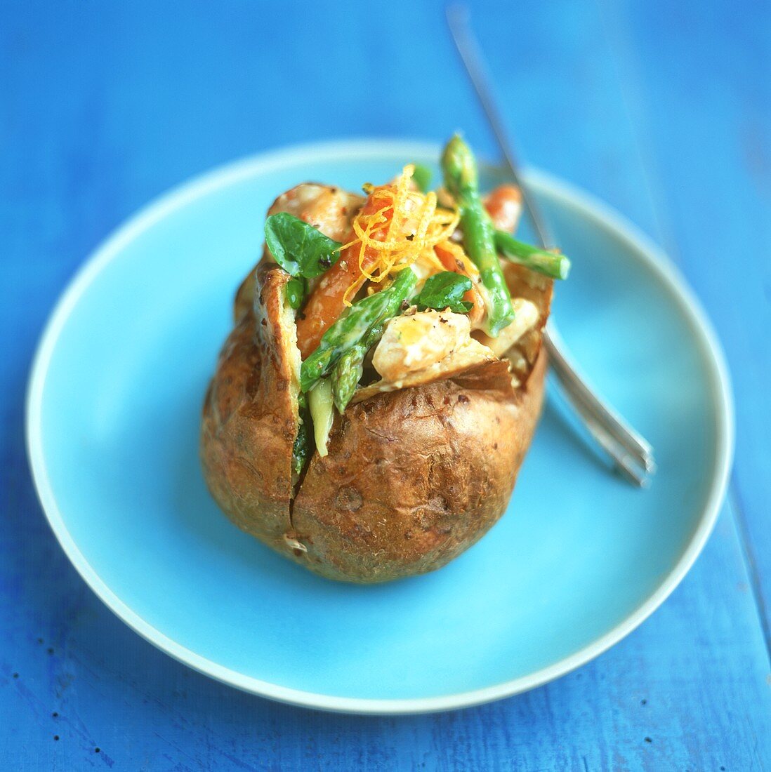 Baked potatoes, filled with asparagus and carrot salad