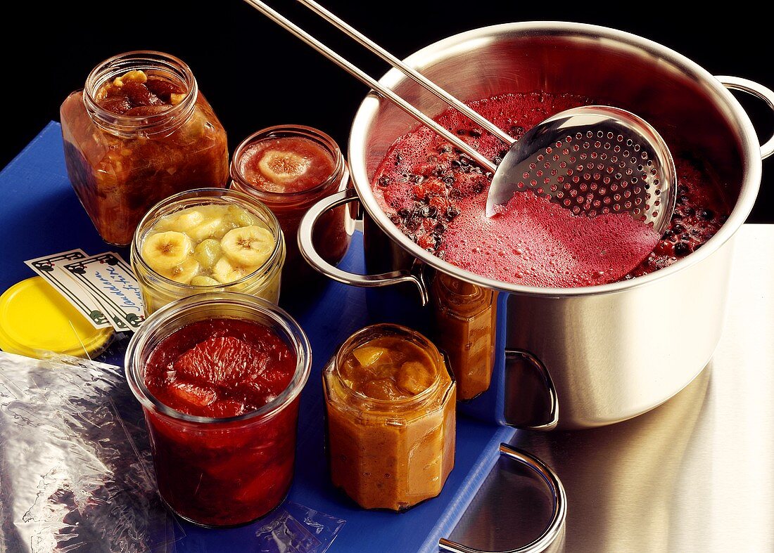 Five jam jars, jam pan and skimmer