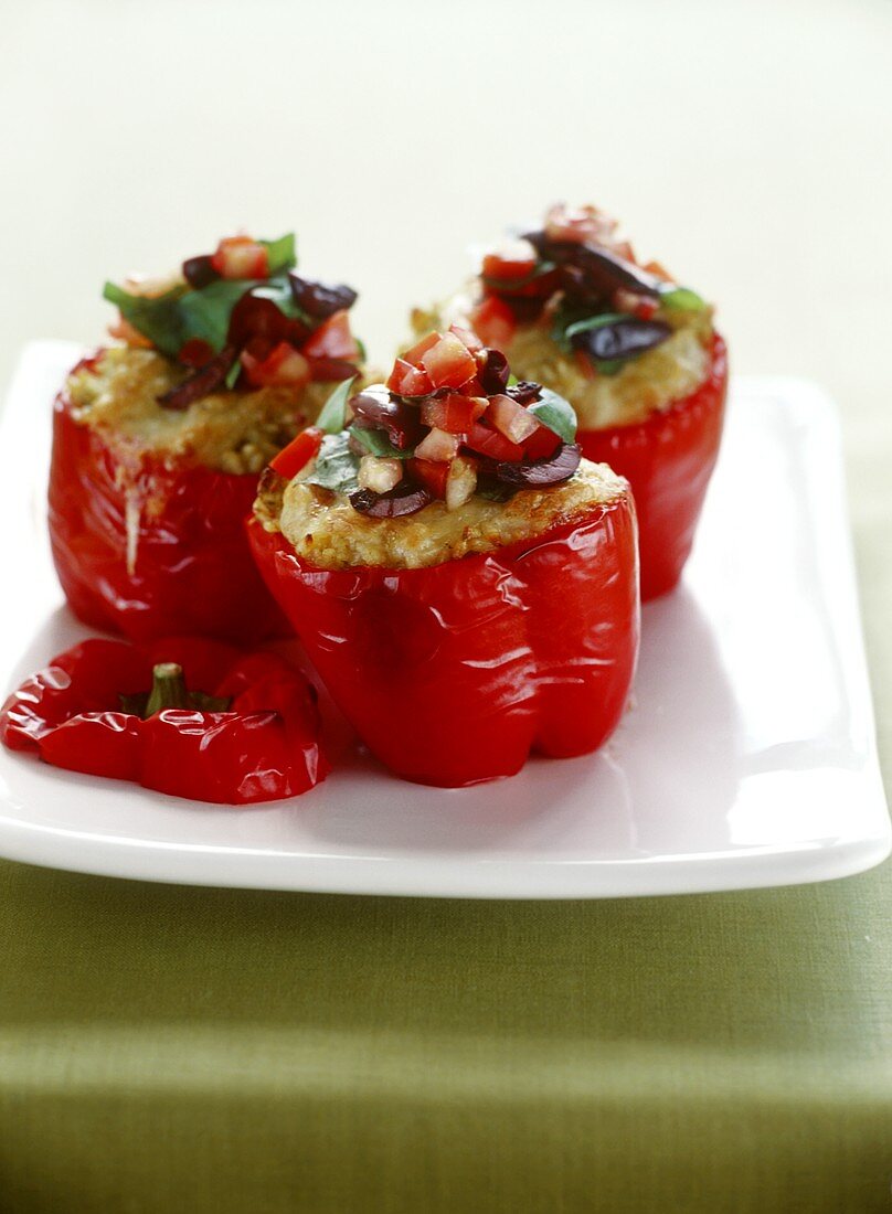 Peppers stuffed with rice and tomato and olive salsa