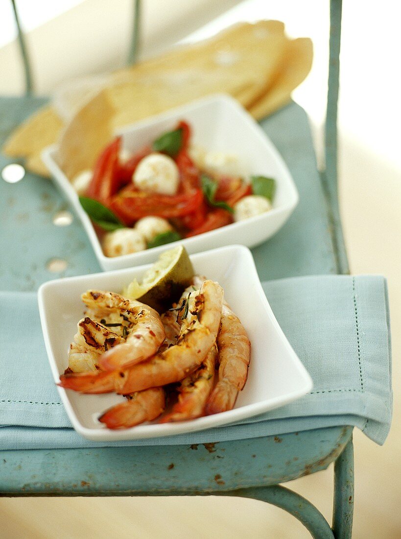 Shrimps with rosemary; tomato and mozzarella salad