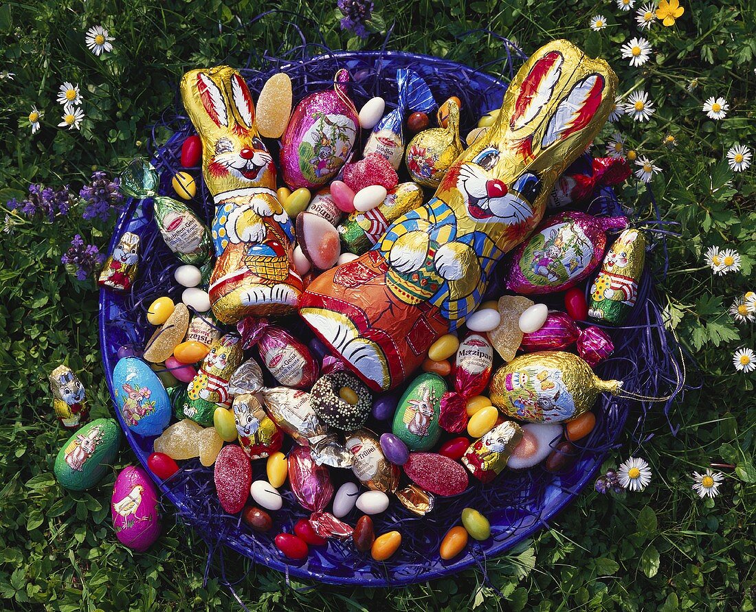 Bowl of Easter sweets in the meadow
