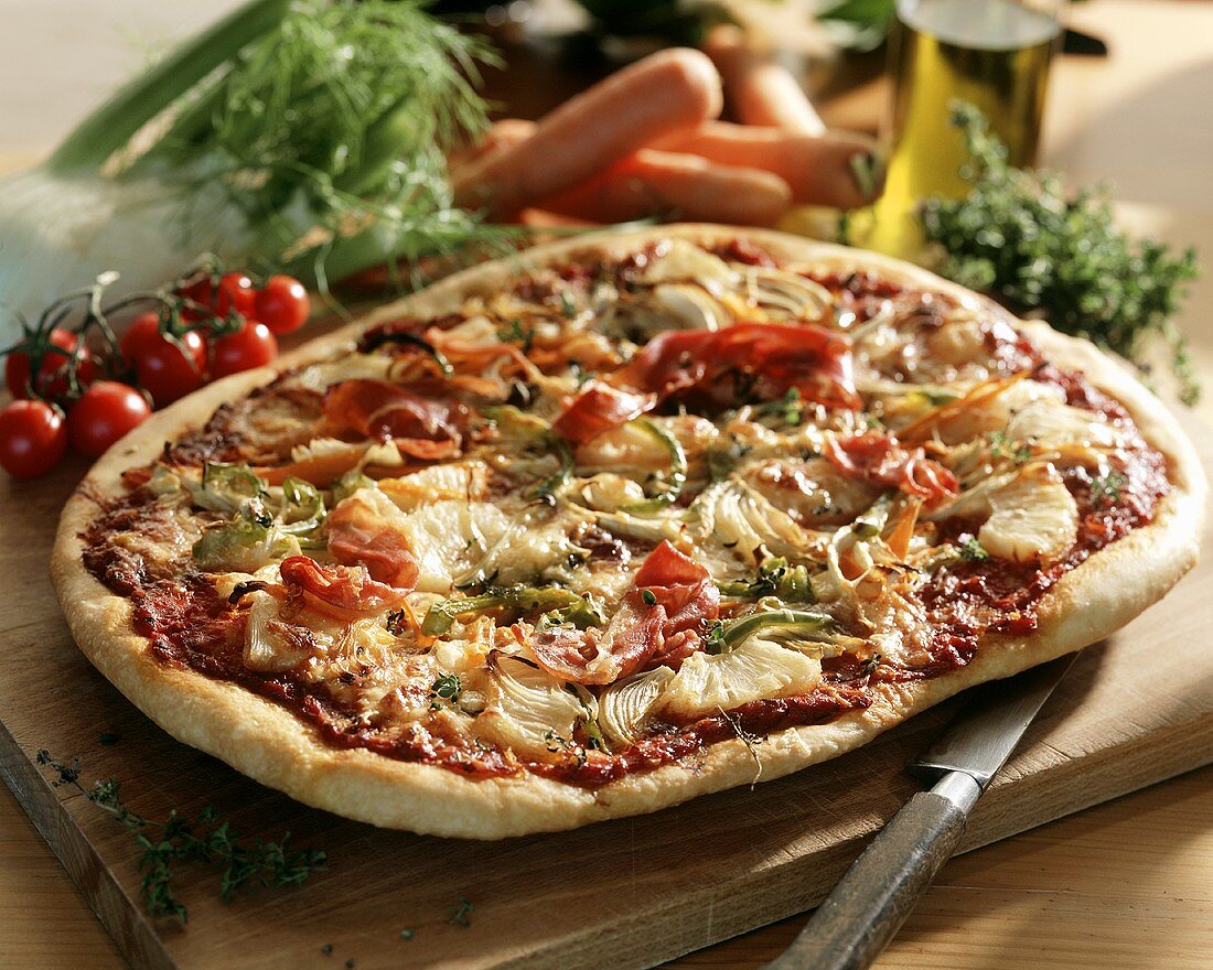 Pizza with vegetables, ham and pineapple