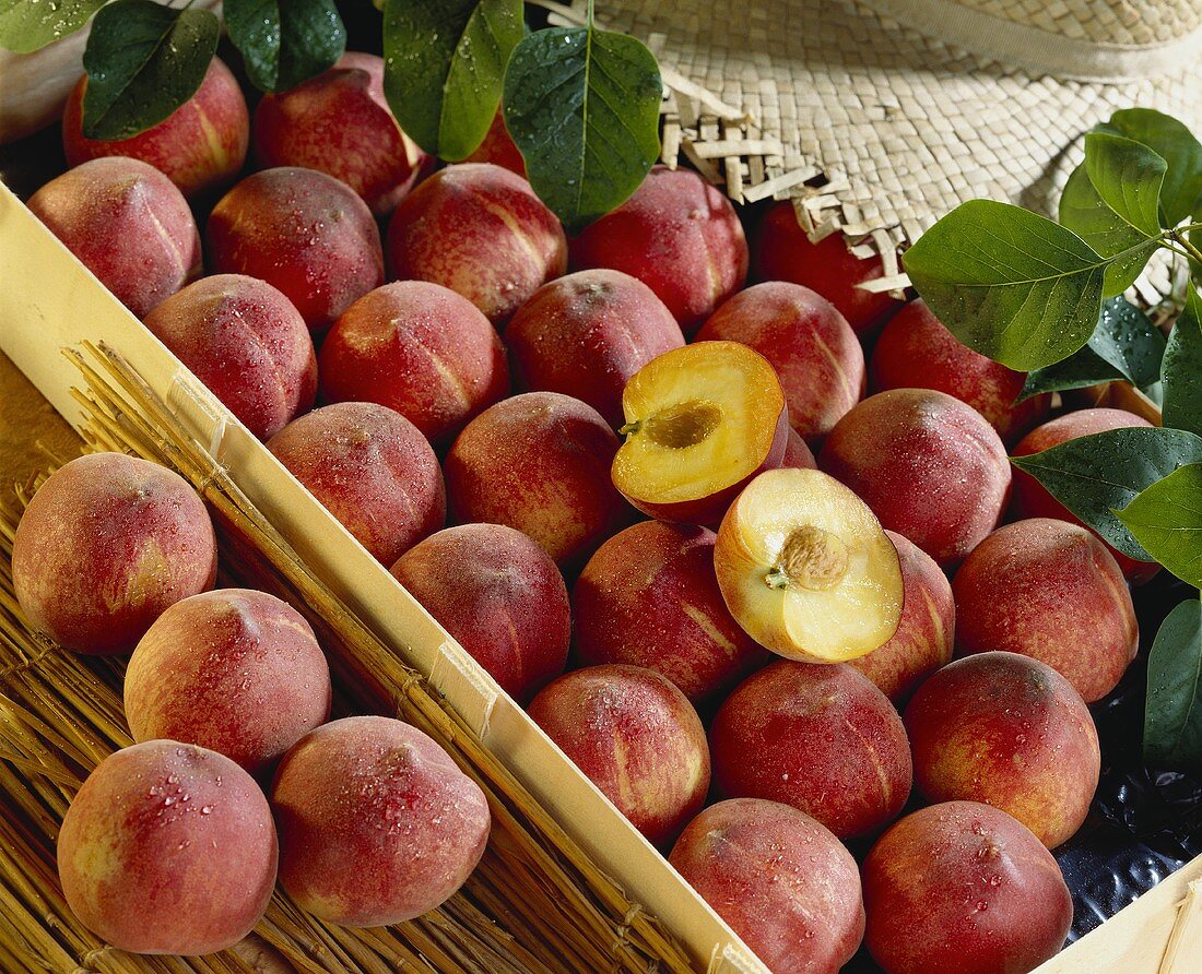 Peaches in crates, whole and halved