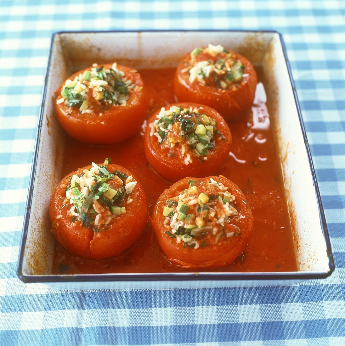 Stuffed tomatoes with rice, courgettes and herbs