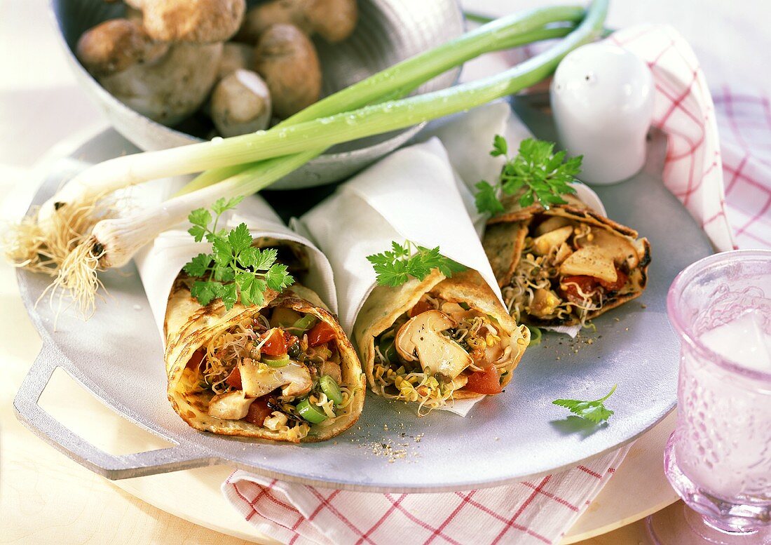 Wraps with sprout and mushroom filling and spring onions