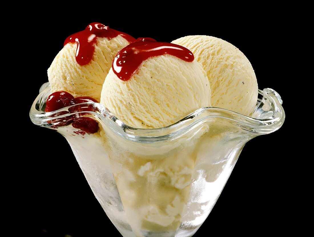 Vanilla ice cream with cherry sauce in sundae glass