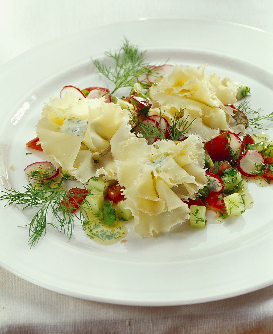 Filled ruffle of Tete-de-Moine cheese on vegetable salad