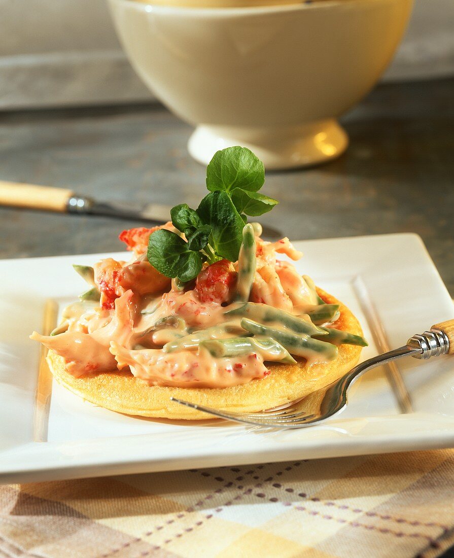 Blini with crab and bean salad