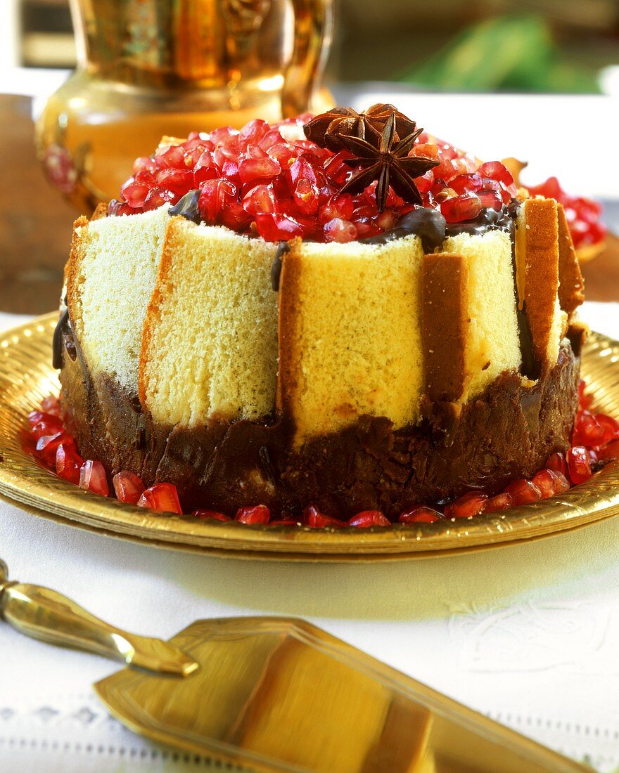 Madeira cake charlotte with chocolate and pomegranate seeds