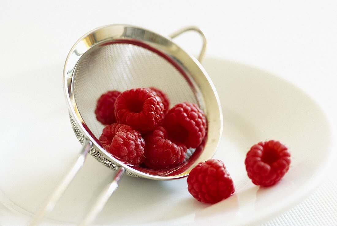 Raspberries in a sieve