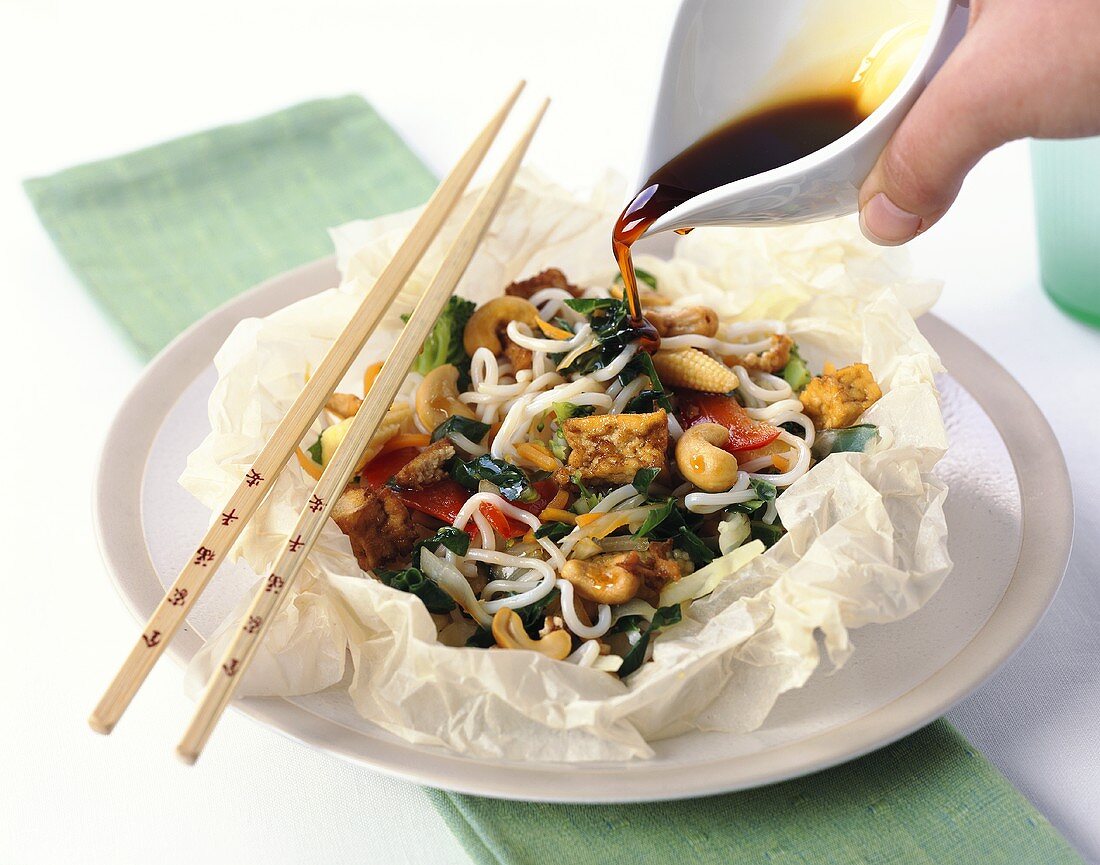Steamed vegetables with noodles, tofu and cashew nuts