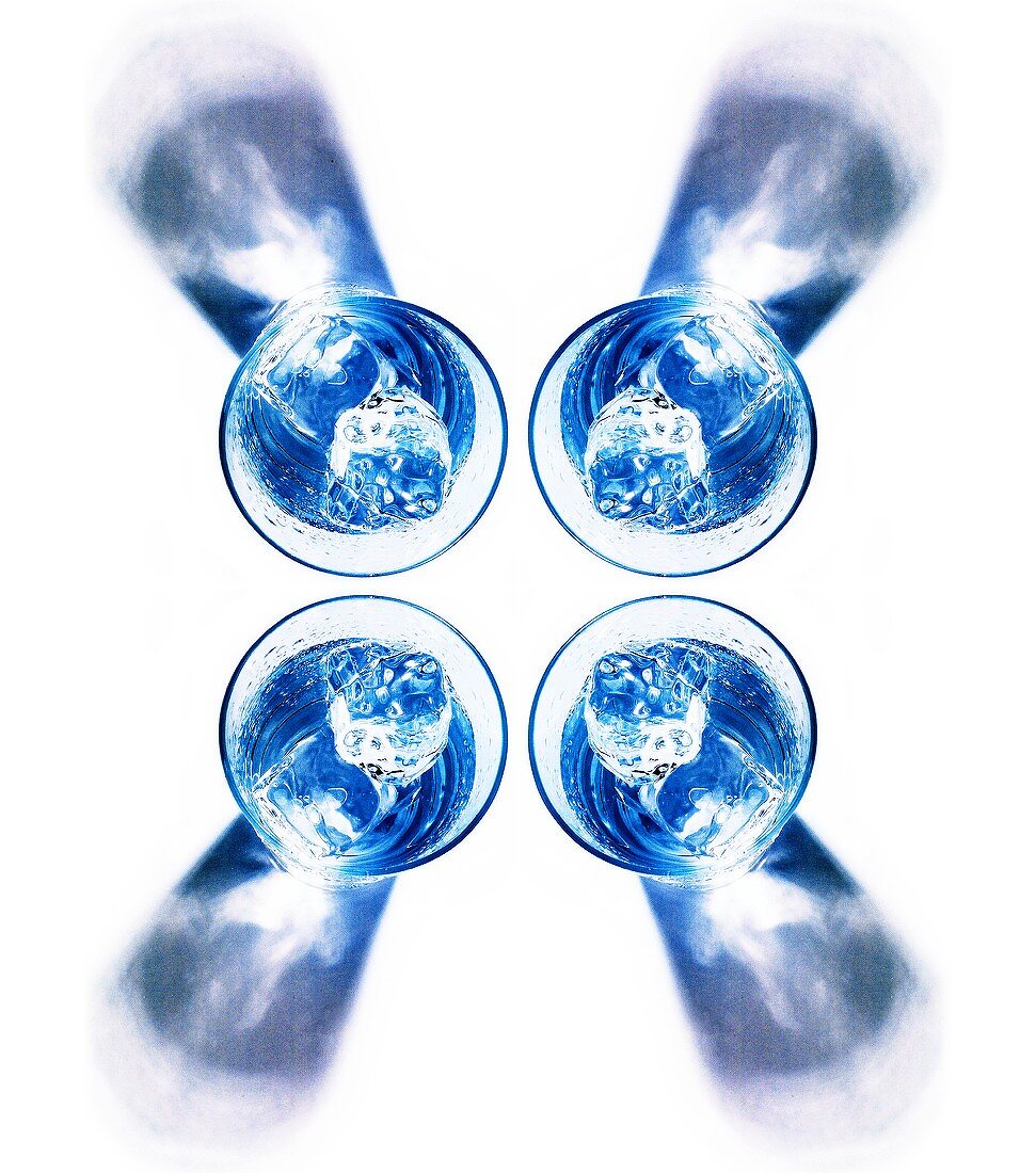 Four glasses of water with ice cubes (from above)