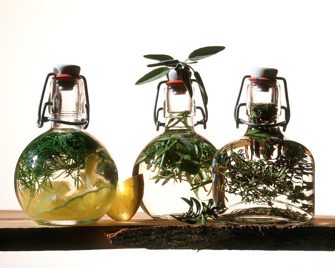 Three bottles of herb vinegar